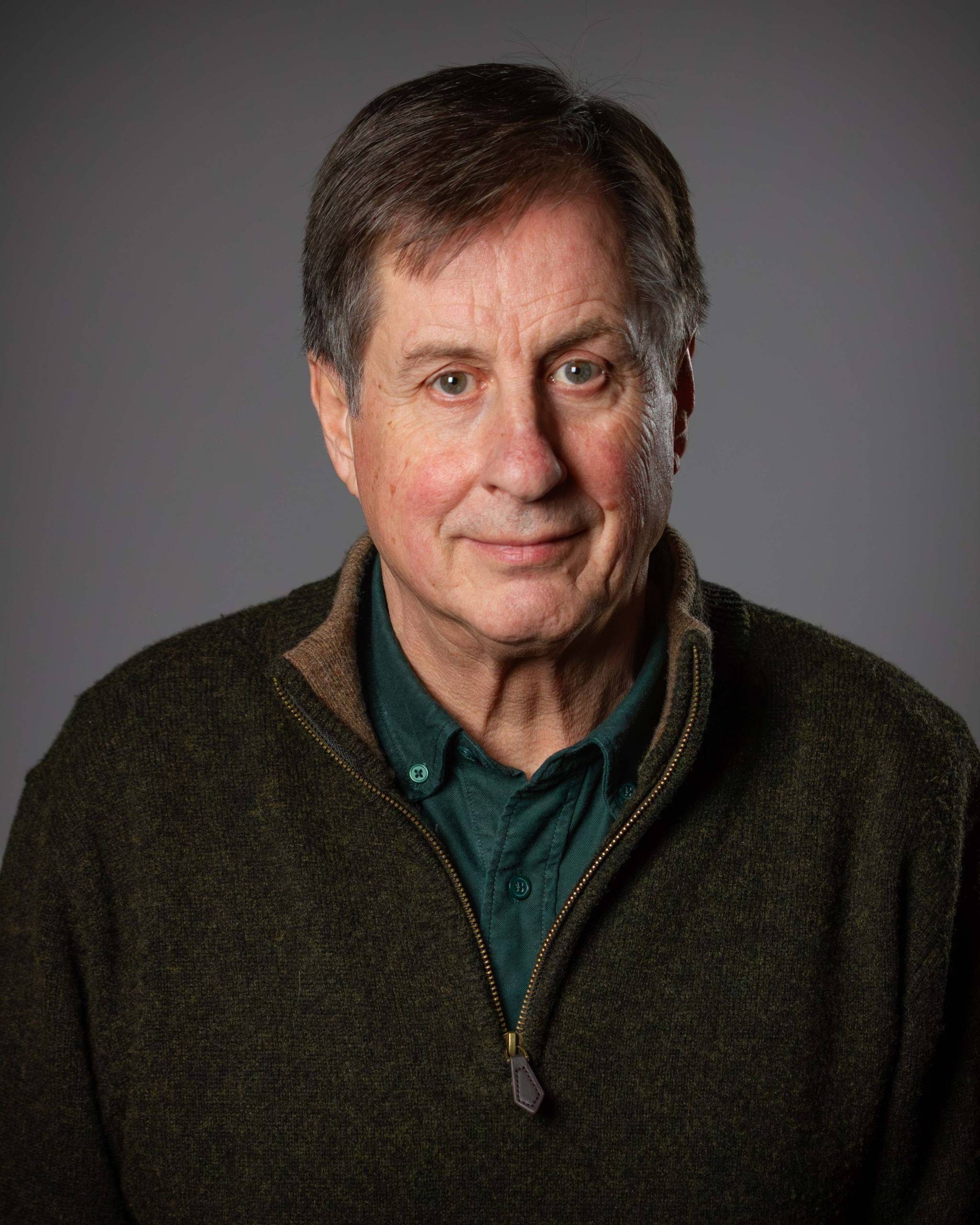 Headshot of Patrick Laurence against a grey background