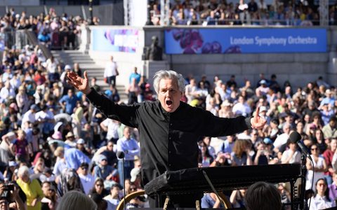 Sir Antonio Pappano with his arms held wide conducting the LSO in Trafalgar Square at BMW Classics 2026